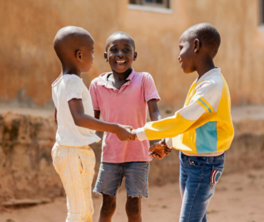 medium-shot-smiley-african-boys-playing-together (1)