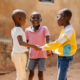 medium-shot-smiley-african-boys-playing-together (1)